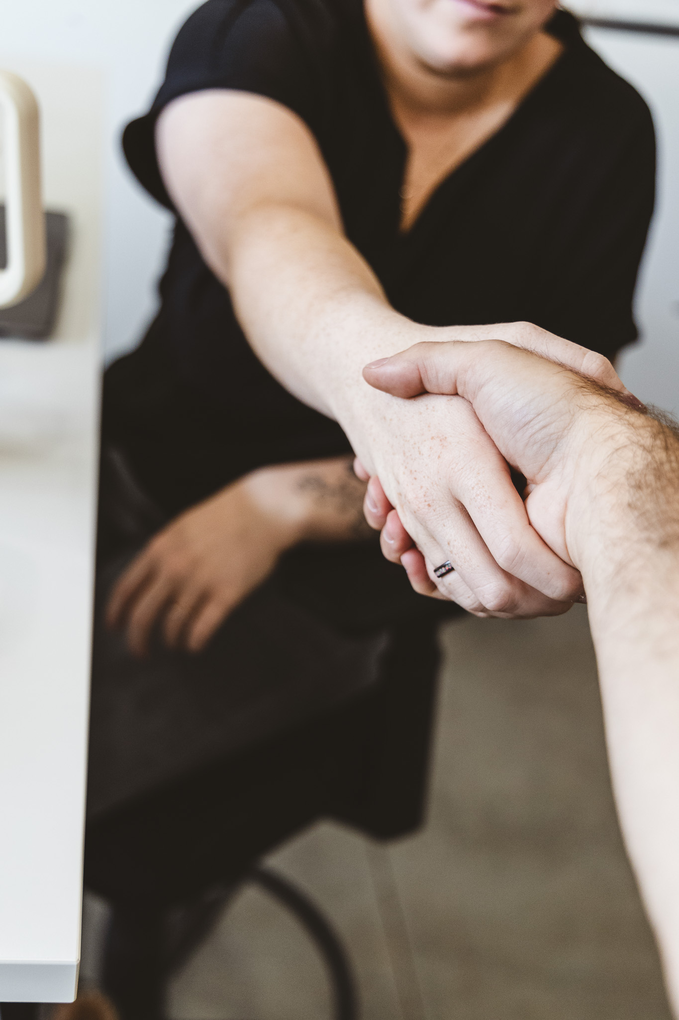 A Five Door Media team member shaking hands with a client