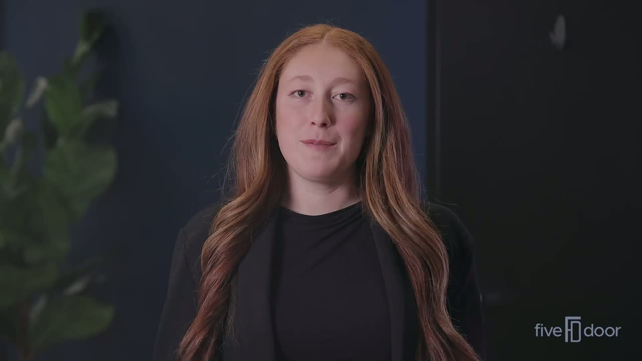 Five Door Media team member on camera in front of the Five Door studio wall, opening the Five Door Method explainer.