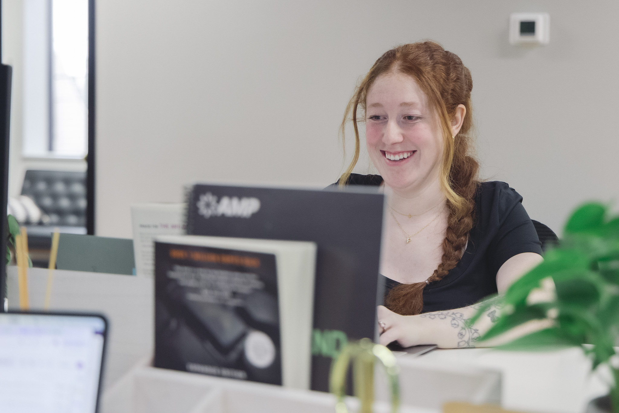 A Five Door Media team member welcoming a visitor at the office front desk